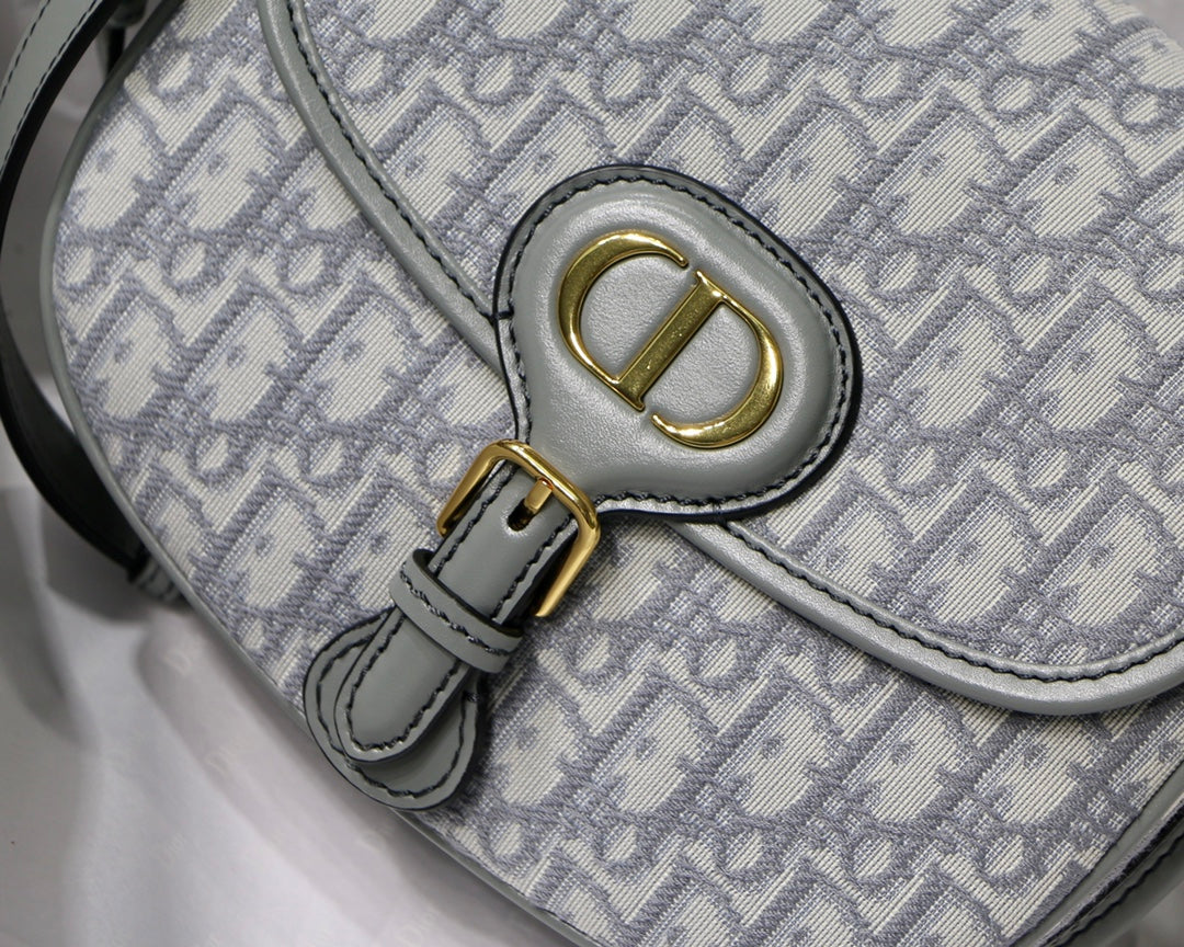 MEDIUM CD BOBBY 22CM GREY OBLIQUE CANVAS GOLD HARDWARE