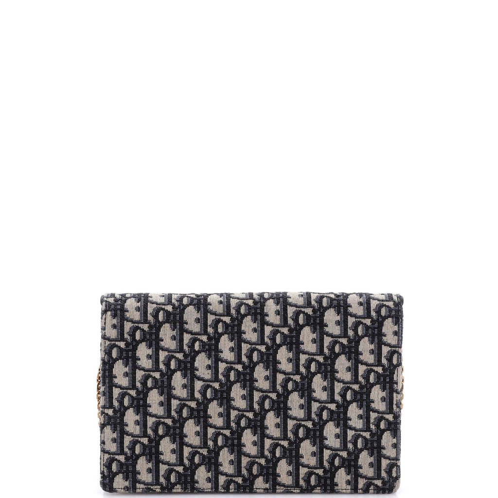 Saddle Chain Clutch Oblique Canvas