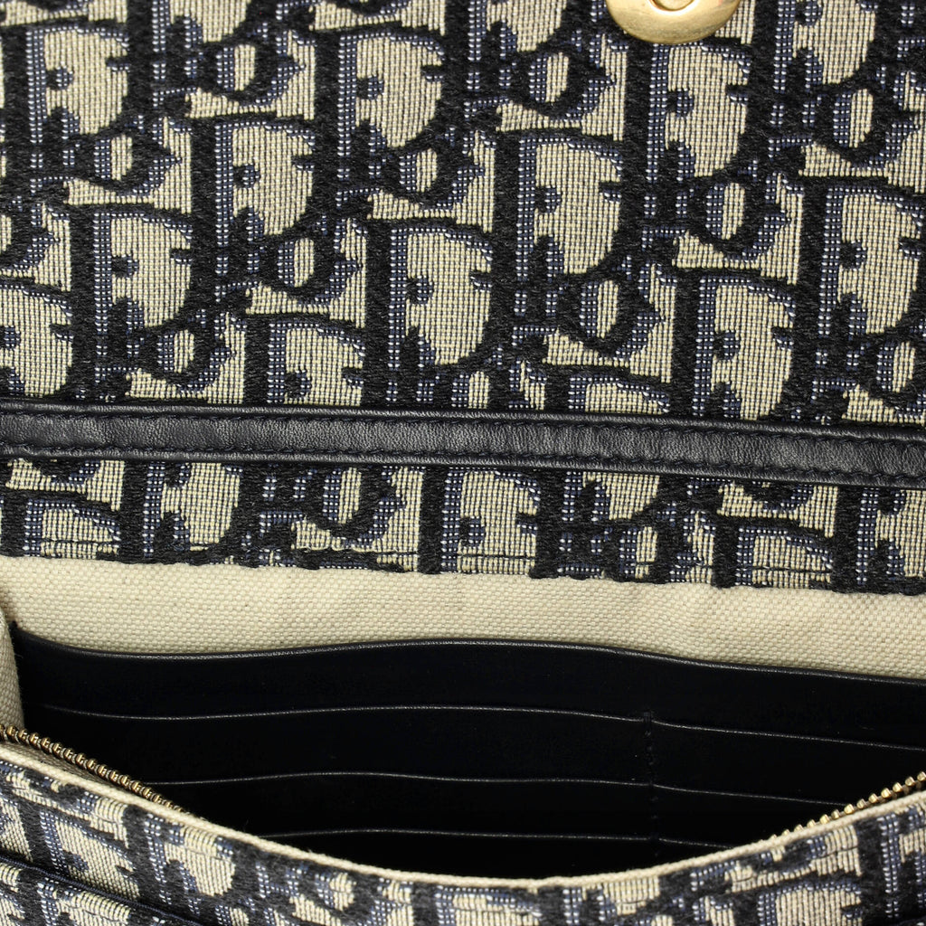 Saddle Chain Clutch Oblique Canvas