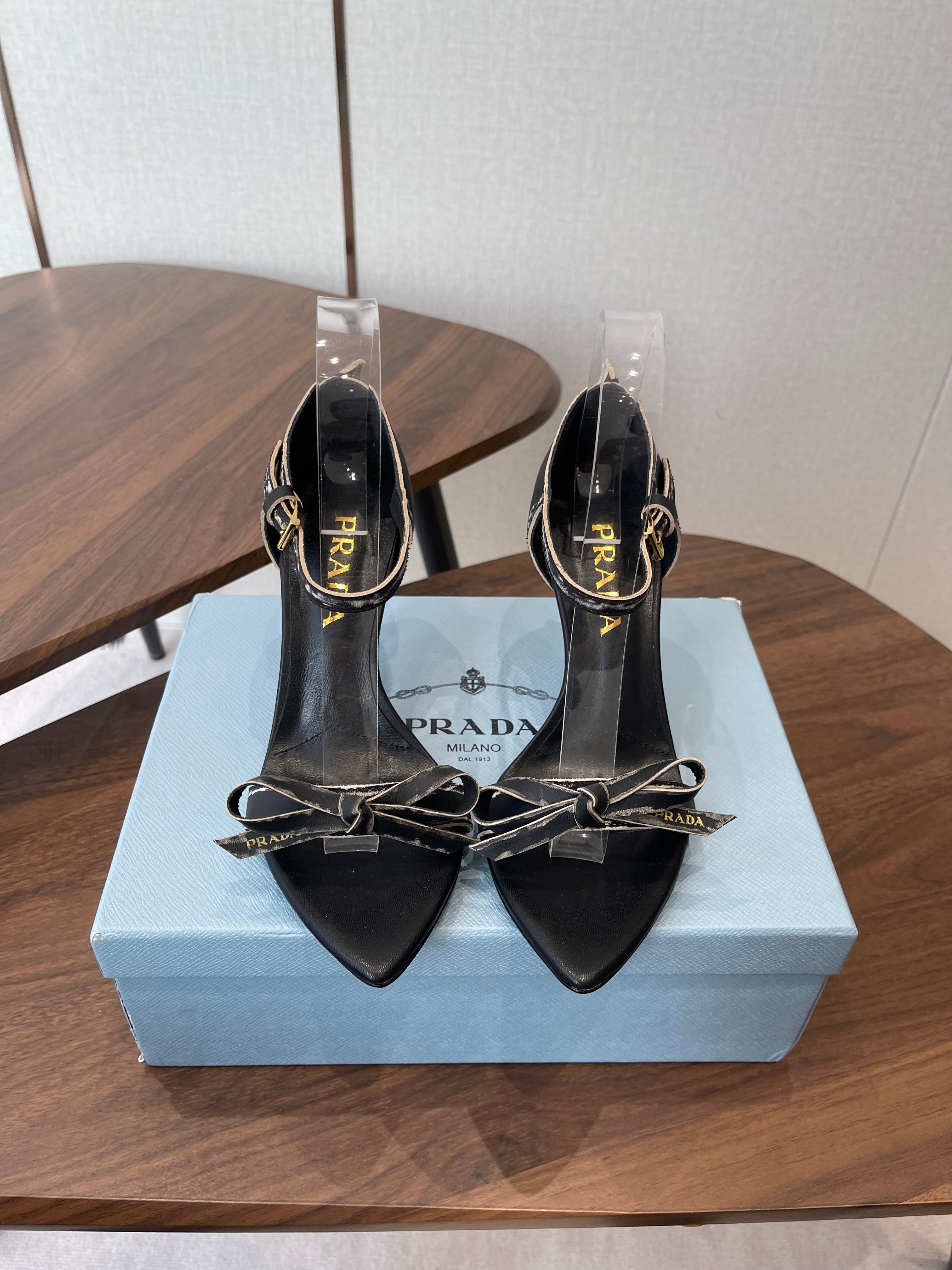 PRADA 26S HIGH HEEL SANDALS 85MM IN BLACK CALFSKIN WITH BOW