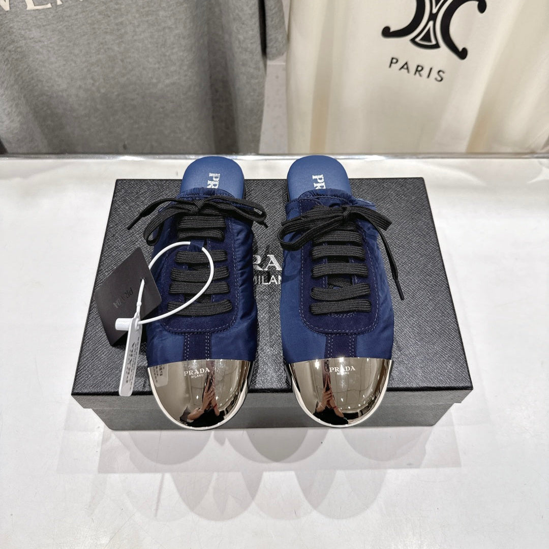 PRADA 25S MULES IN DARK BLUE WITH METAL TOECAP