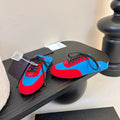 SNEAKER MULES IN BLUE NYLON AND RED SUEDE