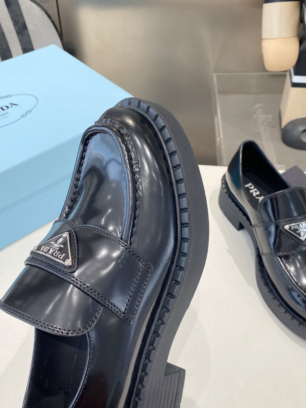 PRADA 26S LOAFERS IN BLACK CALFSKIN WITH LOGO SILVER HARDWARE