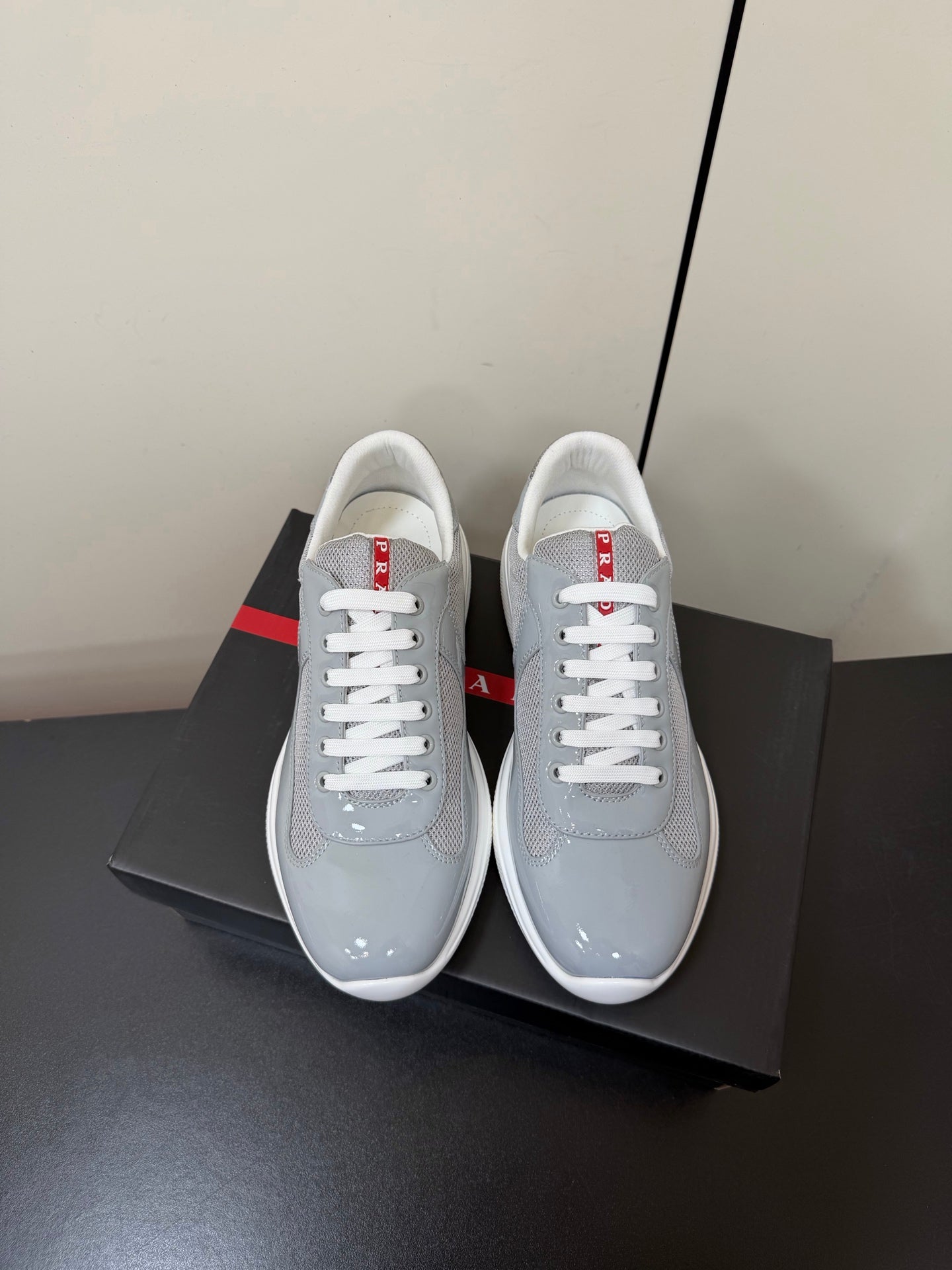 PRADA 26S SNEAKERS IN LIGHT GRAY PATENT CALFSKIN AND WHITE MESH