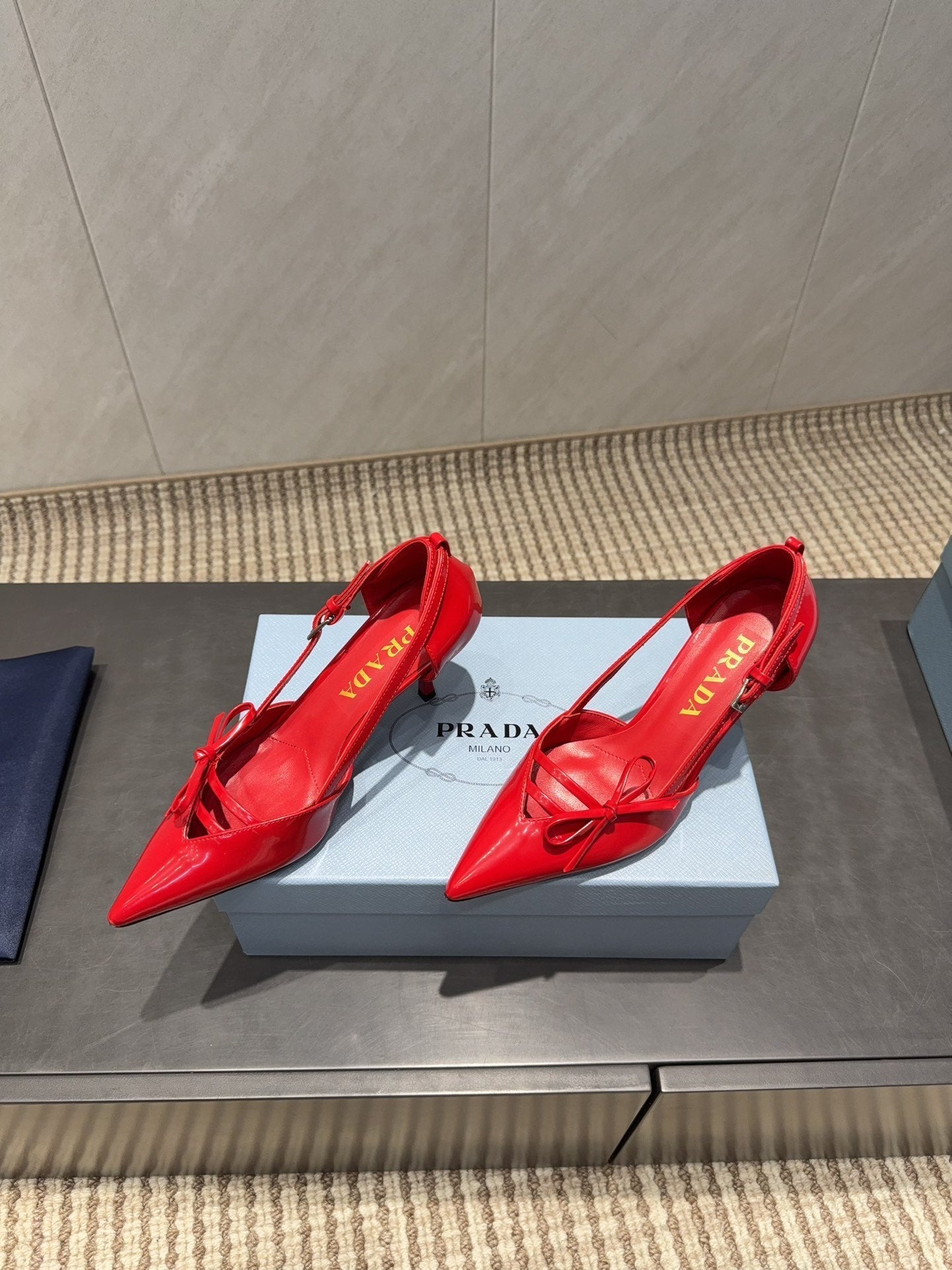 PRADA 26S POINTED TOE CUT OUT HIGH HEELS 75MM IN BRIGHT RED CALFSKIN WITH BOW
