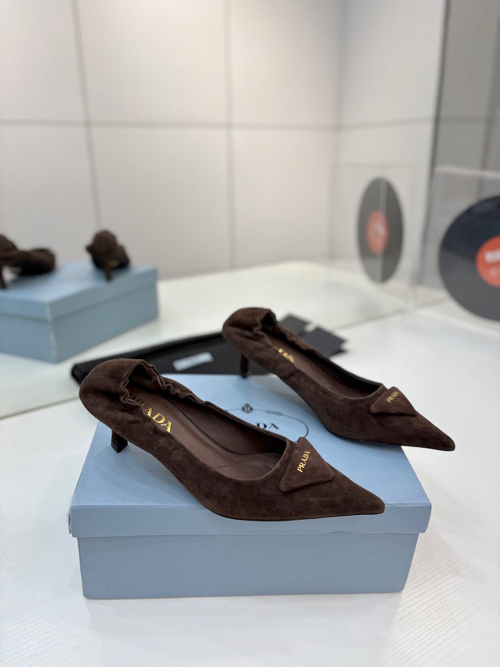 PRADA 26S PUMPS 55MM IN DARK BROWN SUEDE WITH LOGO